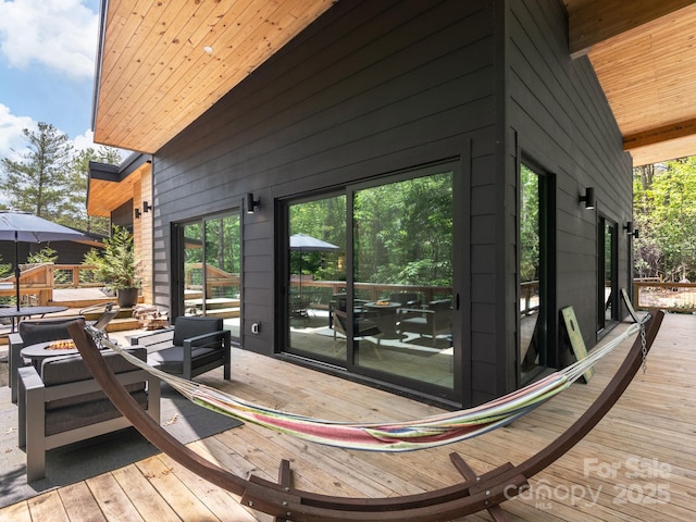 1761 Williamson Creek Rd, Pisgah Forest, NC 28768 - deck with an outdoor living space with a fire pit