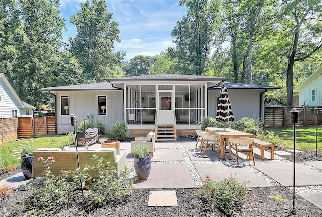 4906 Crooked Oak Ln, Charlotte, NC 28226 - rear view of property featuring a sunroom, a patio area, outdoor dining area, and an outdoor living space