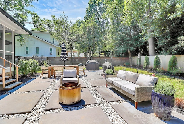 4906 Crooked Oak Ln, Charlotte, NC 28226 - fenced backyard with a patio area and an outdoor living space with a fire pit