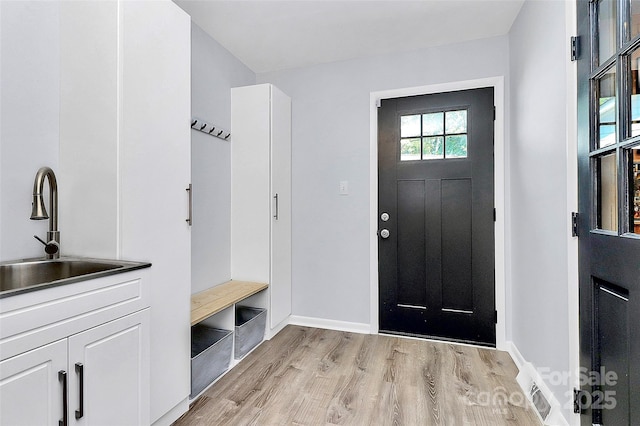 4906 Crooked Oak Ln, Charlotte, NC 28226 - mudroom with a sink and light wood-style floors