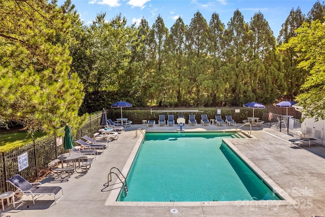 145 Summerbrook Ln, Mooresville, NC 28117 - community pool with a patio and view of wooded area