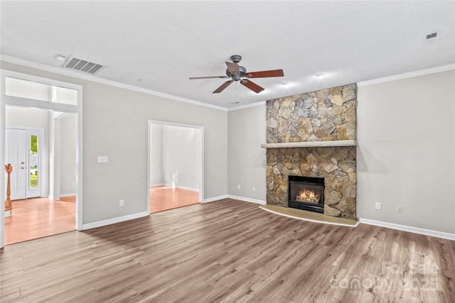 145 Summerbrook Ln, Mooresville, NC 28117 - unfurnished living room featuring ceiling fan, wood finished floors, ornamental molding, and a fireplace