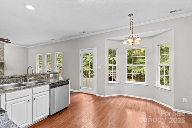145 Summerbrook Ln, Mooresville, NC 28117 - kitchen featuring dishwasher, white cabinetry, light wood finished floors, healthy amount of natural light, and crown molding