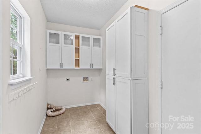 145 Summerbrook Ln, Mooresville, NC 28117 - washroom featuring electric dryer hookup, cabinet space, washer hookup, and a textured ceiling