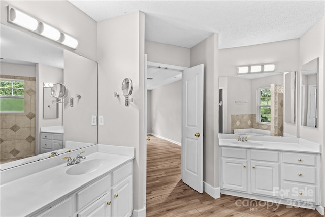 145 Summerbrook Ln, Mooresville, NC 28117 - full bath featuring plenty of natural light, a garden tub, vanity, and wood finished floors