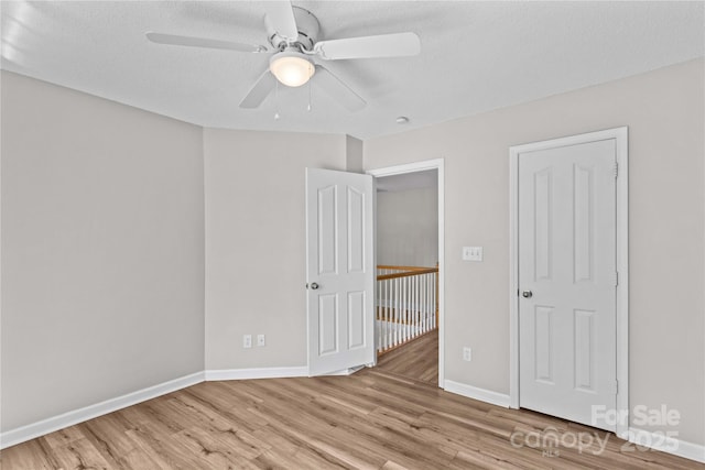 145 Summerbrook Ln, Mooresville, NC 28117 - unfurnished bedroom featuring light wood-style floors and a ceiling fan