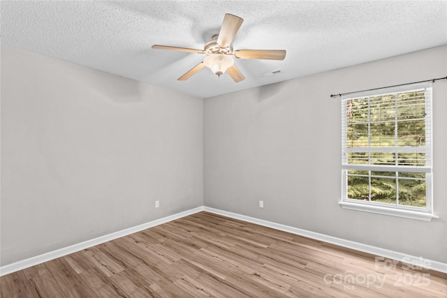 145 Summerbrook Ln, Mooresville, NC 28117 - unfurnished room with wood finished floors, a textured ceiling, and a ceiling fan