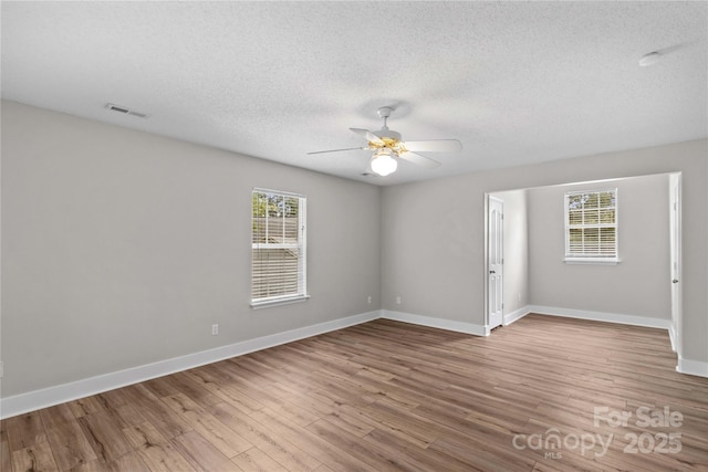 145 Summerbrook Ln, Mooresville, NC 28117 - empty room with ceiling fan, wood finished floors, and a textured ceiling