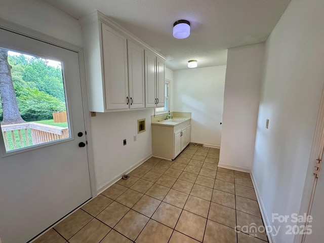635 Windsor Pl NE, Concord, NC 28025 - laundry area with cabinet space, washer hookup, electric dryer hookup, and healthy amount of natural light