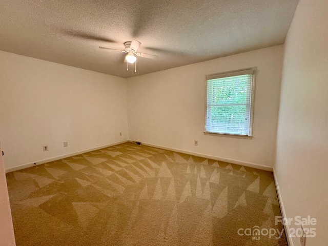 635 Windsor Pl NE, Concord, NC 28025 - unfurnished room featuring ceiling fan, carpet flooring, and a textured ceiling