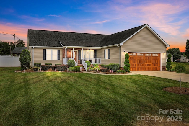 1974 Redwood Dr, Oakboro, NC 28129 - ranch-style house featuring covered porch, an attached garage, driveway, and roof with shingles