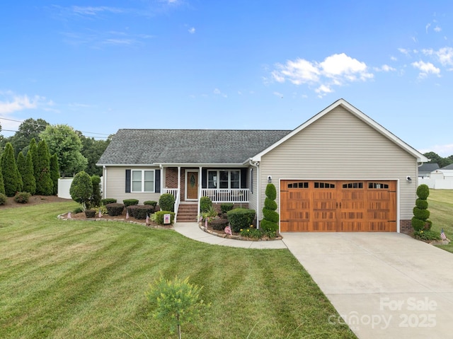 1974 Redwood Dr, Oakboro, NC 28129 - ranch-style home with a porch, an attached garage, a front lawn, driveway, and roof with shingles