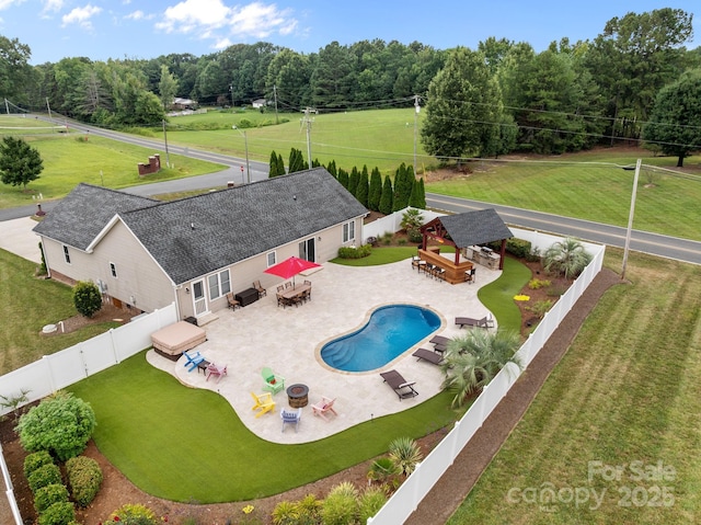 1974 Redwood Dr, Oakboro, NC 28129 - view of swimming pool featuring a gazebo, a fenced backyard, a patio area, outdoor dining area, and a view of trees