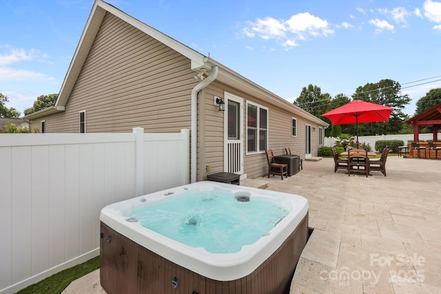 1974 Redwood Dr, Oakboro, NC 28129 - view of patio / terrace featuring a hot tub and outdoor dining area