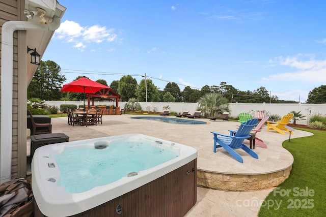 1974 Redwood Dr, Oakboro, NC 28129 - view of swimming pool featuring a hot tub, a patio, a fenced backyard, and outdoor dining area