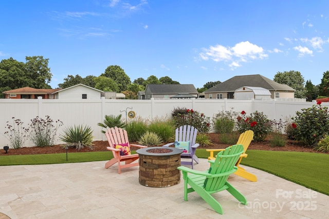 1974 Redwood Dr, Oakboro, NC 28129 - fenced backyard featuring a fire pit and a patio area