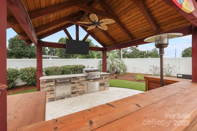 1974 Redwood Dr, Oakboro, NC 28129 - fenced backyard featuring a gazebo, area for grilling, ceiling fan, and a patio