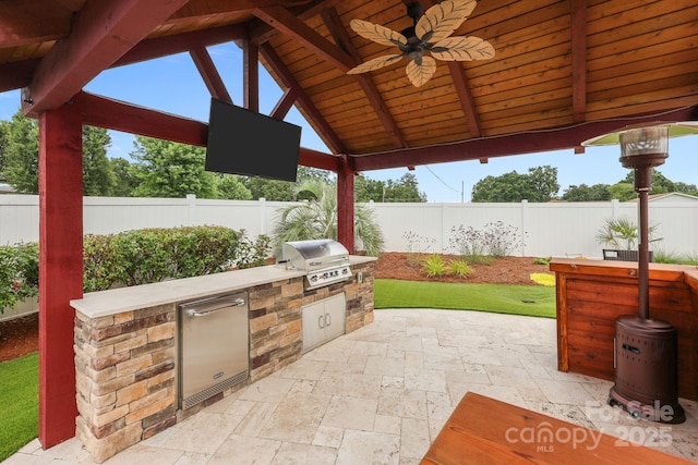 1974 Redwood Dr, Oakboro, NC 28129 - fenced backyard featuring exterior kitchen, ceiling fan, a patio area, and a gazebo