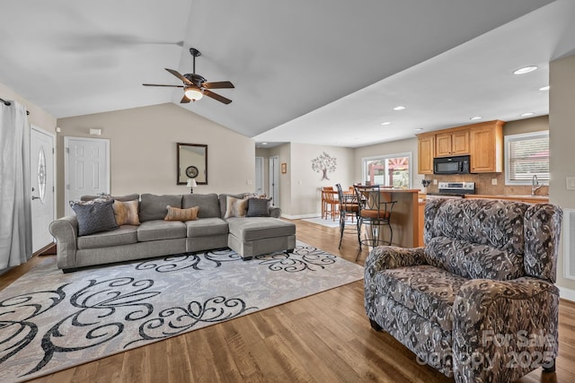 1974 Redwood Dr, Oakboro, NC 28129 - living area with wood finished floors, a ceiling fan, lofted ceiling, and recessed lighting