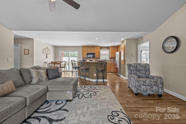 1974 Redwood Dr, Oakboro, NC 28129 - living room with wood finished floors, a ceiling fan, and recessed lighting