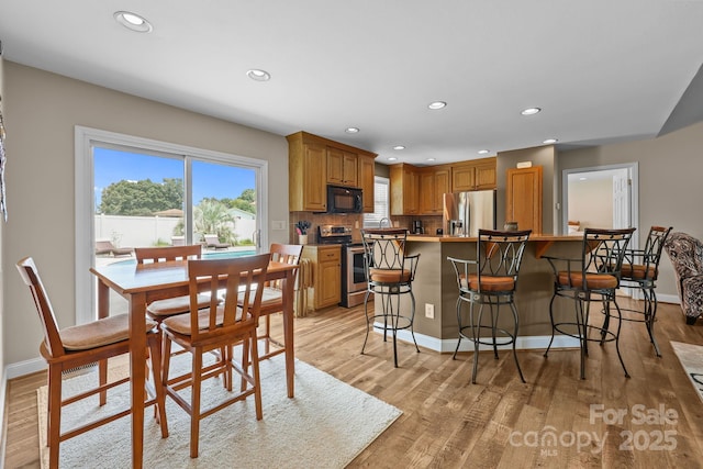 1974 Redwood Dr, Oakboro, NC 28129 - dining space featuring recessed lighting and light wood finished floors