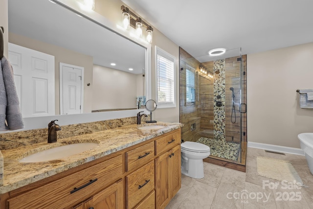 1974 Redwood Dr, Oakboro, NC 28129 - bathroom with a stall shower, double vanity, and a freestanding bath