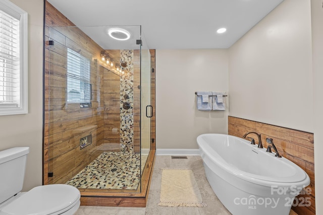 1974 Redwood Dr, Oakboro, NC 28129 - full bath with a freestanding tub, a shower stall, tile patterned floors, and recessed lighting