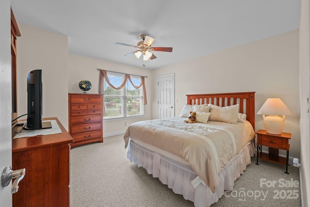 1974 Redwood Dr, Oakboro, NC 28129 - bedroom with light colored carpet, ceiling fan, and a closet