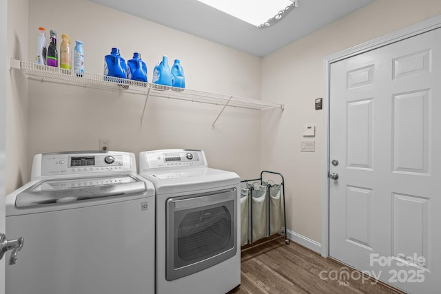 1974 Redwood Dr, Oakboro, NC 28129 - laundry room featuring washer and dryer and dark wood-style flooring