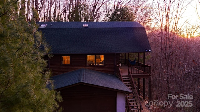 2311 Old Mountain Rd, Mars Hill, NC 28754 - view of front of home featuring a shingled roof, stairs, and a garage