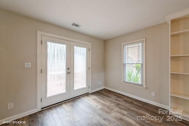 608 Laurel Fork Dr, Matthews, NC 28105 - doorway with french doors, wood finished floors, and built in features