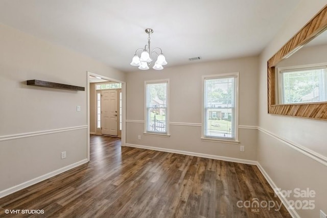 608 Laurel Fork Dr, Matthews, NC 28105 - unfurnished dining area featuring a chandelier and dark wood-type flooring