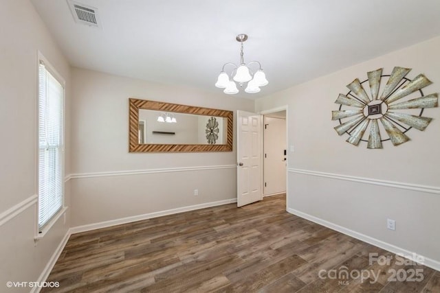 608 Laurel Fork Dr, Matthews, NC 28105 - empty room featuring a chandelier and wood finished floors