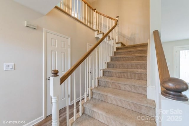 608 Laurel Fork Dr, Matthews, NC 28105 - stairs with wood finished floors and baseboards