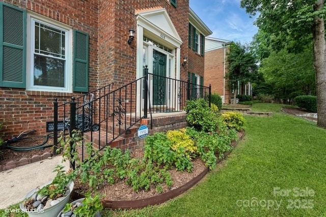608 Laurel Fork Dr, Matthews, NC 28105 - property entrance featuring brick siding and a yard