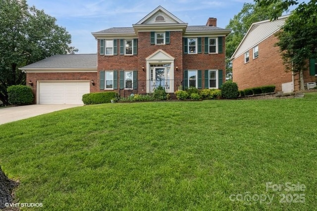 608 Laurel Fork Dr, Matthews, NC 28105 - colonial-style house with brick siding, driveway, a chimney, and an attached garage
