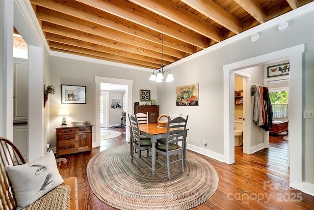 846 Duckback Trl, Whittier, NC 28789 - dining space with a chandelier, wood finished floors, and a wood ceiling with exposed beams