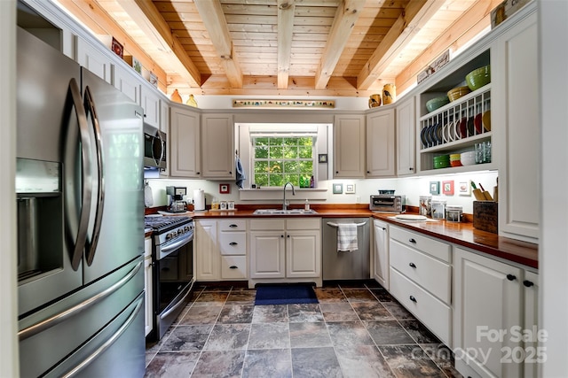 846 Duckback Trl, Whittier, NC 28789 - kitchen featuring stainless steel appliances, butcher block counters, open shelves, a wooden ceiling with exposed beams, and dark stone finish flooring
