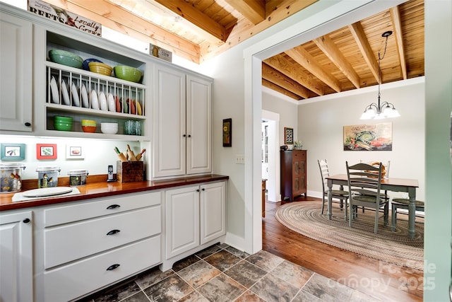 846 Duckback Trl, Whittier, NC 28789 - kitchen with a wood ceiling with exposed beams, open shelves, wooden counters, a chandelier, and hanging light fixtures