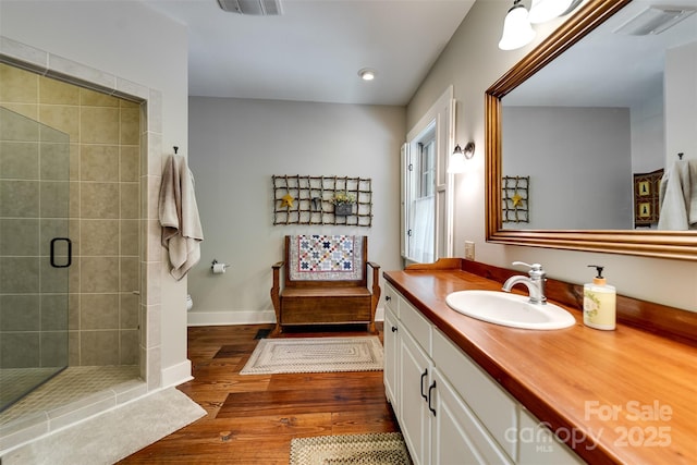 846 Duckback Trl, Whittier, NC 28789 - full bathroom with hardwood / wood-style flooring, vanity, a stall shower, and recessed lighting