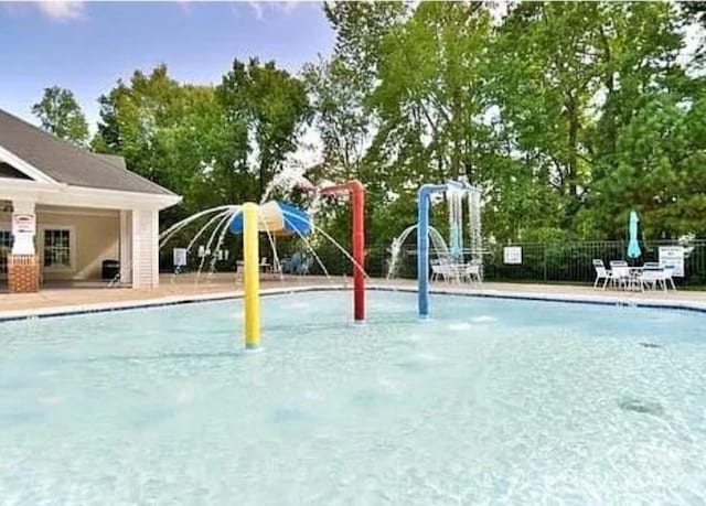2015 Savannah Hills Dr, Matthews, NC 28105 - community pool featuring a water play area and a patio