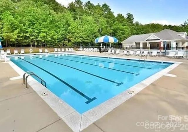 2015 Savannah Hills Dr, Matthews, NC 28105 - community pool featuring a patio area