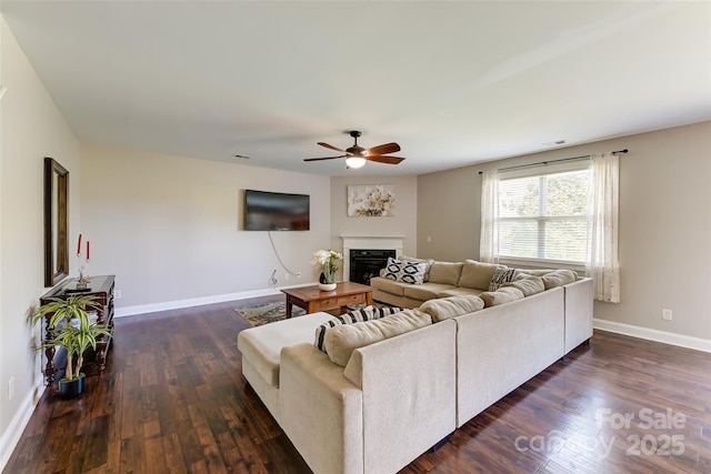 2015 Savannah Hills Dr, Matthews, NC 28105 - living room with ceiling fan, dark wood-type flooring, and a glass covered fireplace
