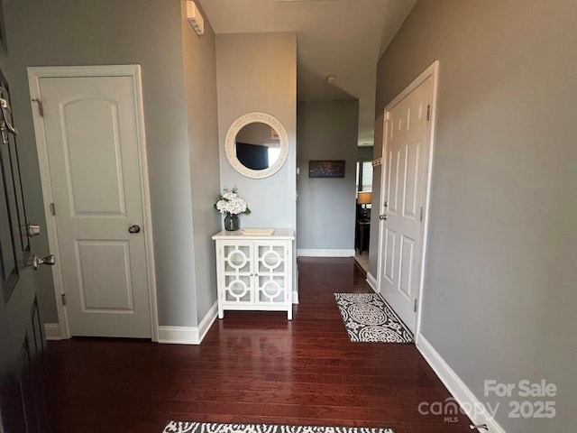 9711 Marquette St NW, Concord, NC 28027 - entryway featuring wood finished floors and baseboards