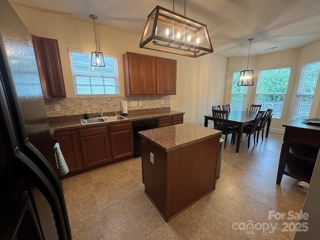 9711 Marquette St NW, Concord, NC 28027 - kitchen with dishwasher, plenty of natural light, a chandelier, and tasteful backsplash