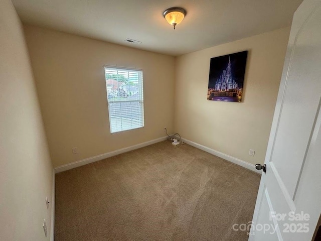 9711 Marquette St NW, Concord, NC 28027 - carpeted spare room with baseboards