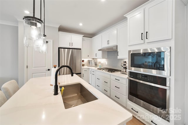 5941 Mantle Way, Kannapolis, NC 28081 - kitchen featuring stainless steel appliances, under cabinet range hood, backsplash, white cabinetry, and crown molding