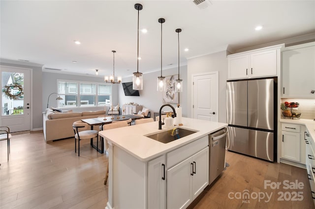 5941 Mantle Way, Kannapolis, NC 28081 - kitchen featuring stainless steel appliances, open floor plan, light wood-style flooring, light countertops, and white cabinetry