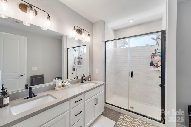 5941 Mantle Way, Kannapolis, NC 28081 - bathroom featuring double vanity, a shower stall, and tile patterned floors