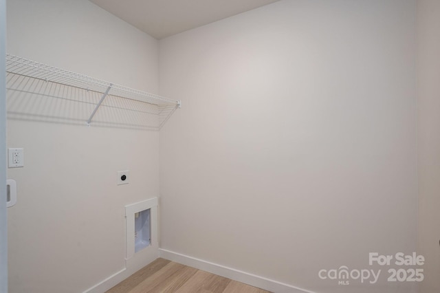 837 32nd St NE, Conover, NC 28613 - laundry area featuring electric dryer hookup and light wood-type flooring